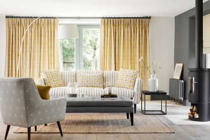 Yellow curtains in a living room by Vanessa Arbuthnott