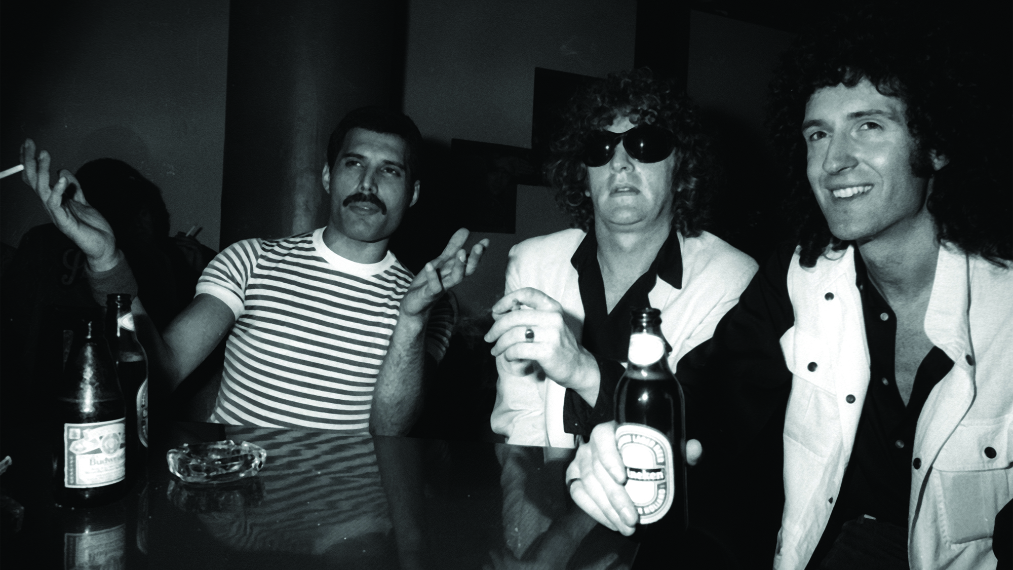 Freddie Mercury of Queen, Ian Hunter, and Brian May of Queen attend Queen Party on August 9, 1982 at Danceteria in New York City.