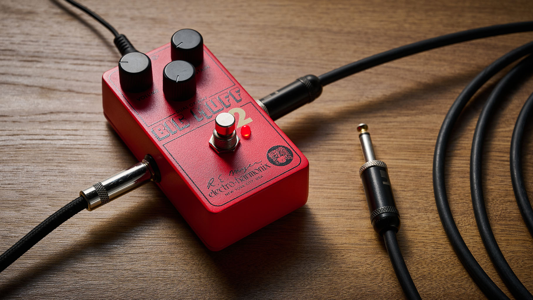 Electro-Harmonix Big Muff Pi 2 Dual Op-Amp Fuzz is built from a lost schematic that's 50 years old but the form factor is familiar for contemporary EHX stompboxes, a three-knob fuzz, red enclosure.