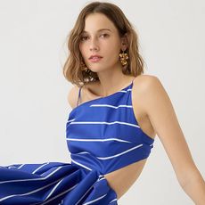 woman wearing blue dress with thin white stripes