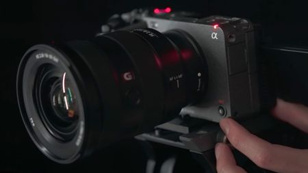 A hand holding the Sony FX3 camera