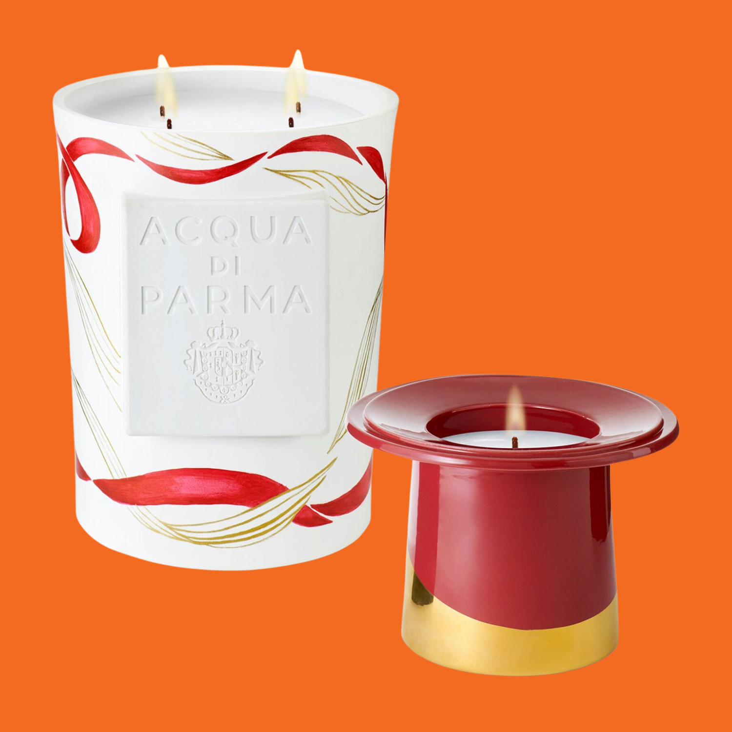 A white candle with a hat-shaped red and gold candle