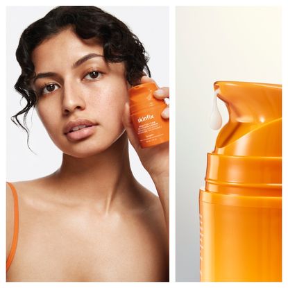 Skinfix orange bottle held by a woman with dark curly hair next to an orange bottle with white cream
