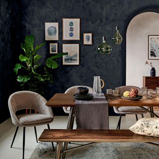 grey dining room with table and plant pot