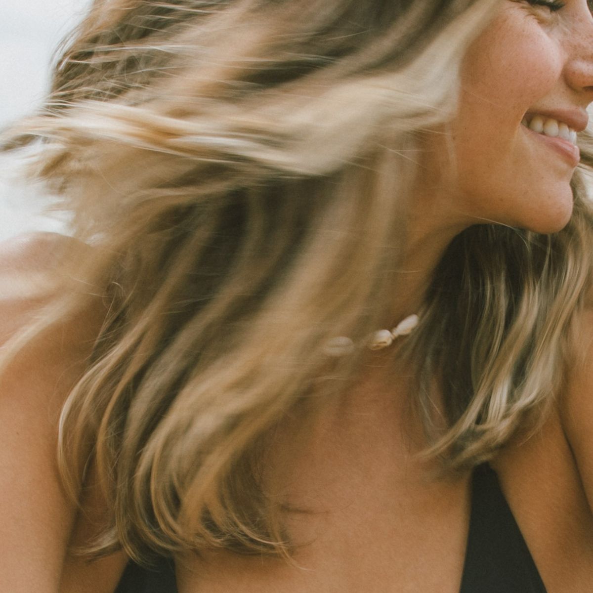 A close up shot of a woman smiling
