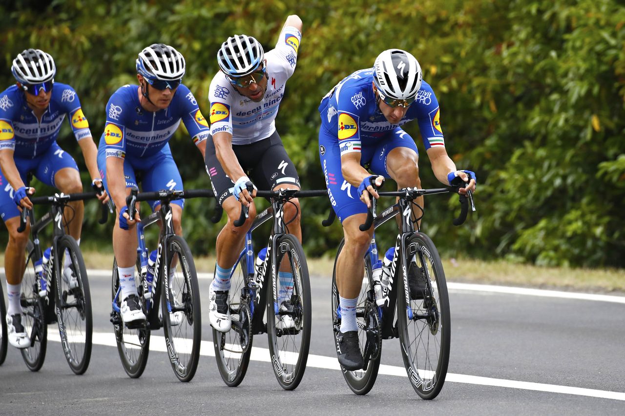 Elia Viviani takes up domestique work, driving the peloton on stage 12