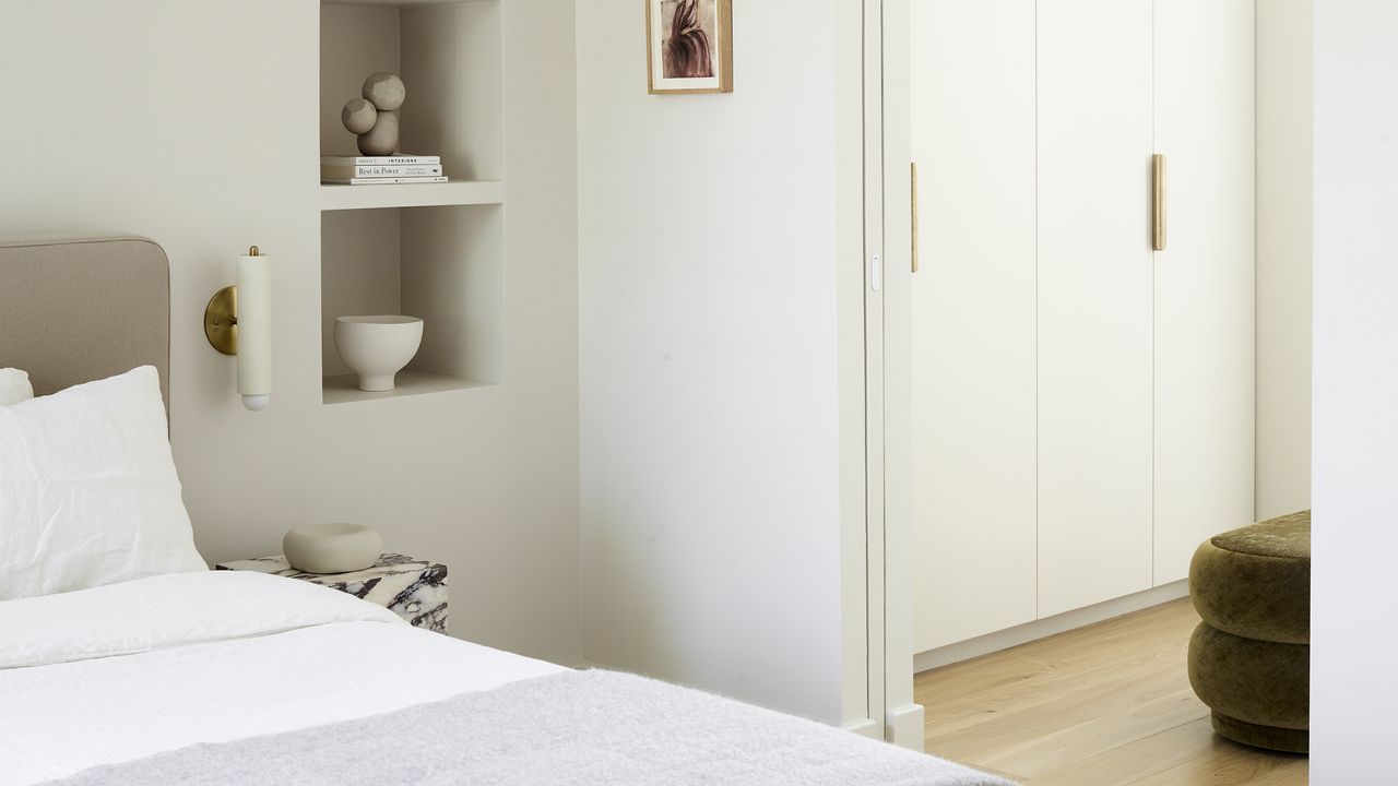 White bedroom with walk in wardrobe