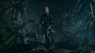 A man with a gun walking through the forest.