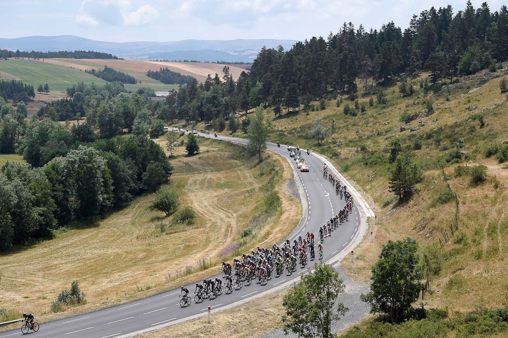The peloton rolls through the French countryside during stage 15.