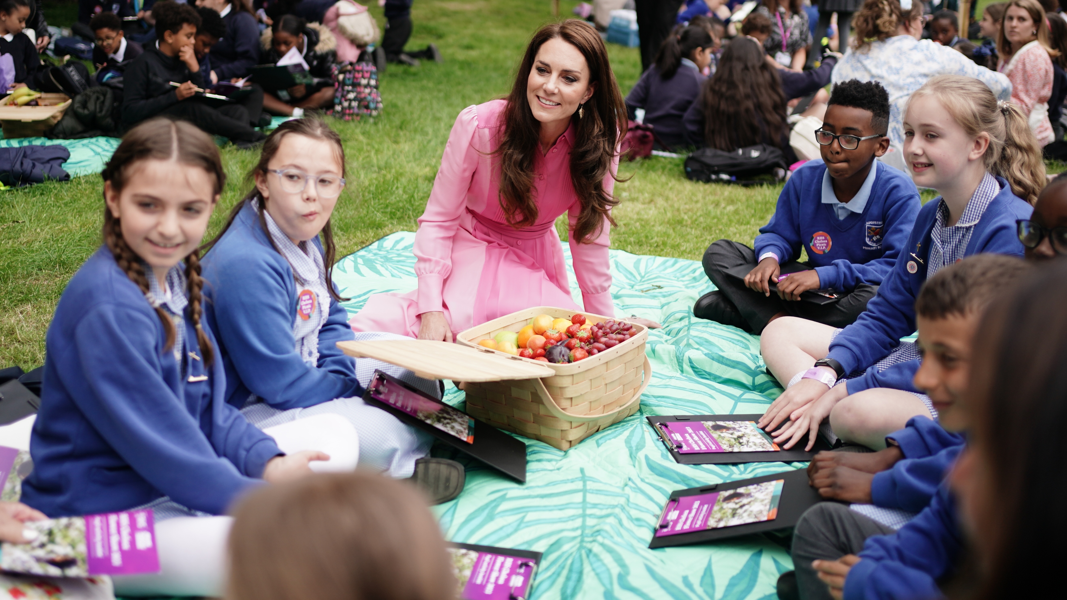 Catherine, Princess of Wales speaks to pupils from schools as she takes part in the first Children's Picnic at the RHS Chelsea Flower Show, at the Royal Hospital Chelsea on May 22, 2023
