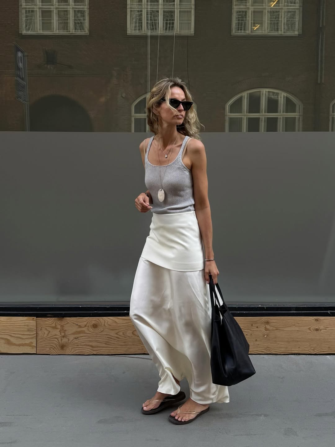 @anoukyve wearing a slip and tank
