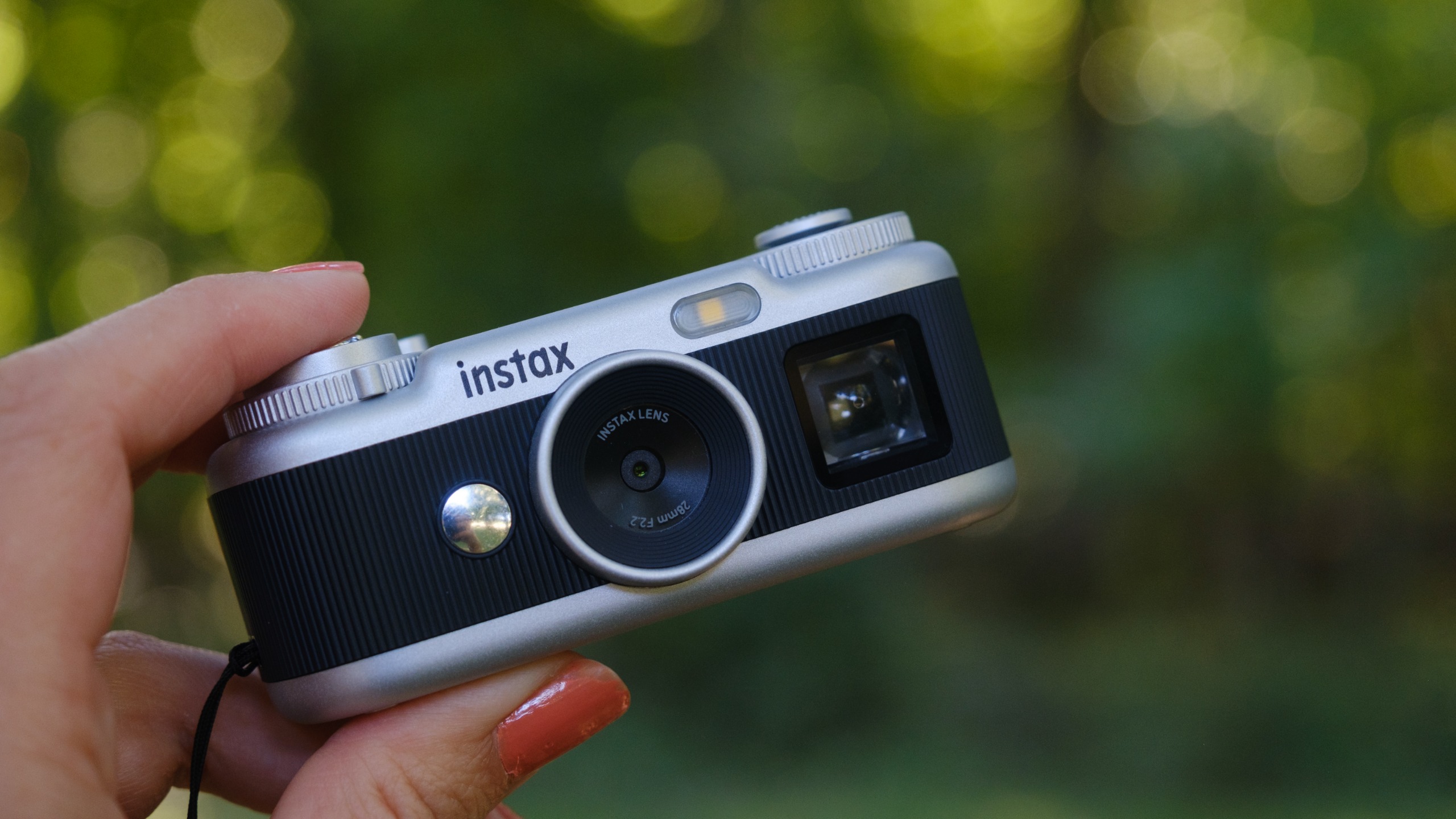 The Instax Pal 2 held in a photographer's hands