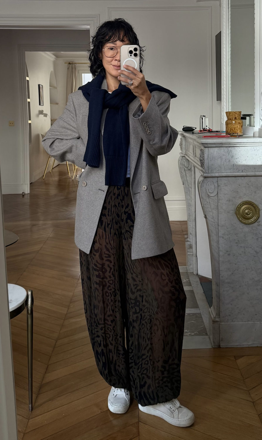 Irene Kim wearing a blazer, brown pants, and sneakers