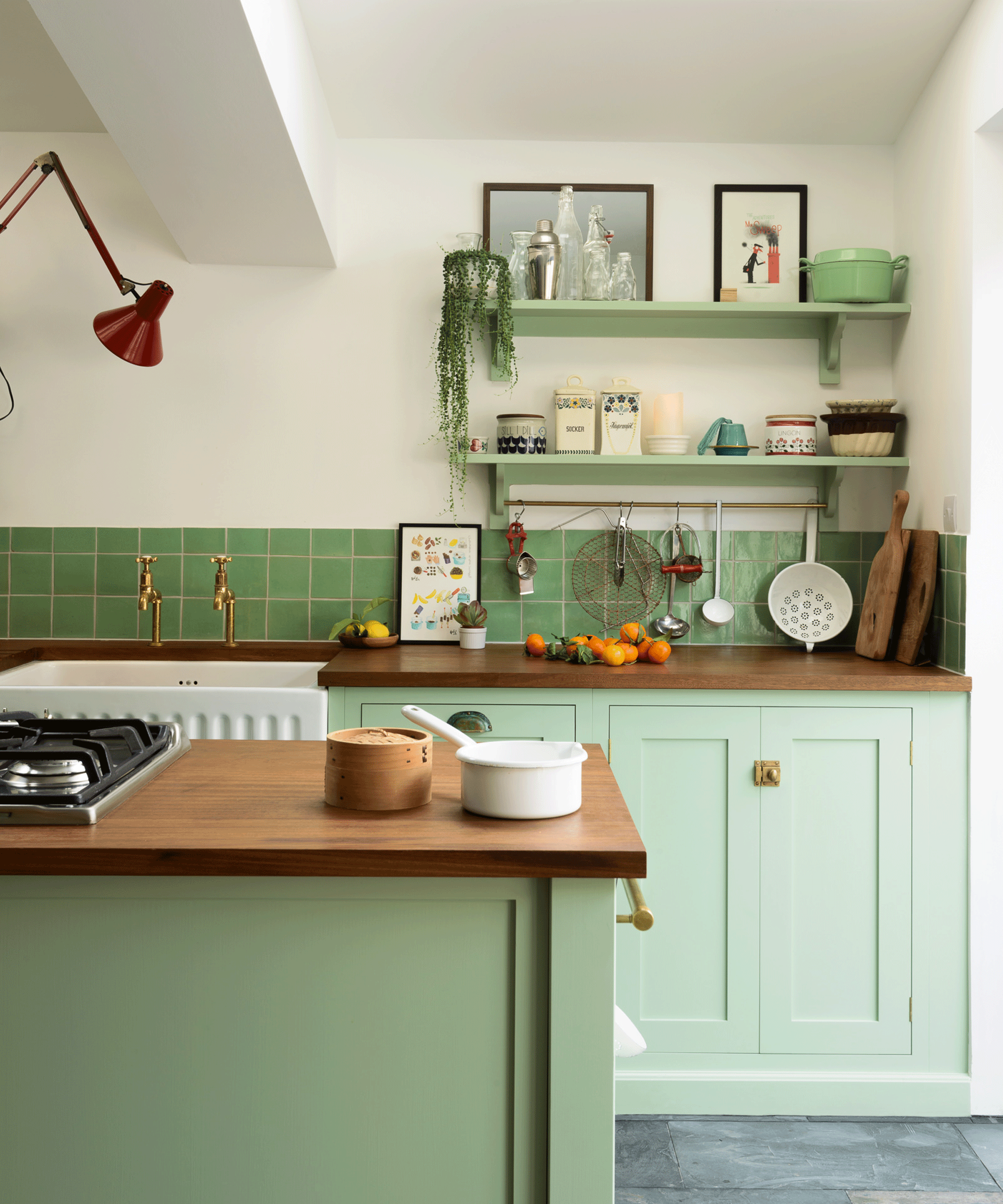 Green kitchen with wooden worktop