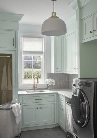 green utility room in Sherwin williams Green Trance by Brad Ramsey Interiors