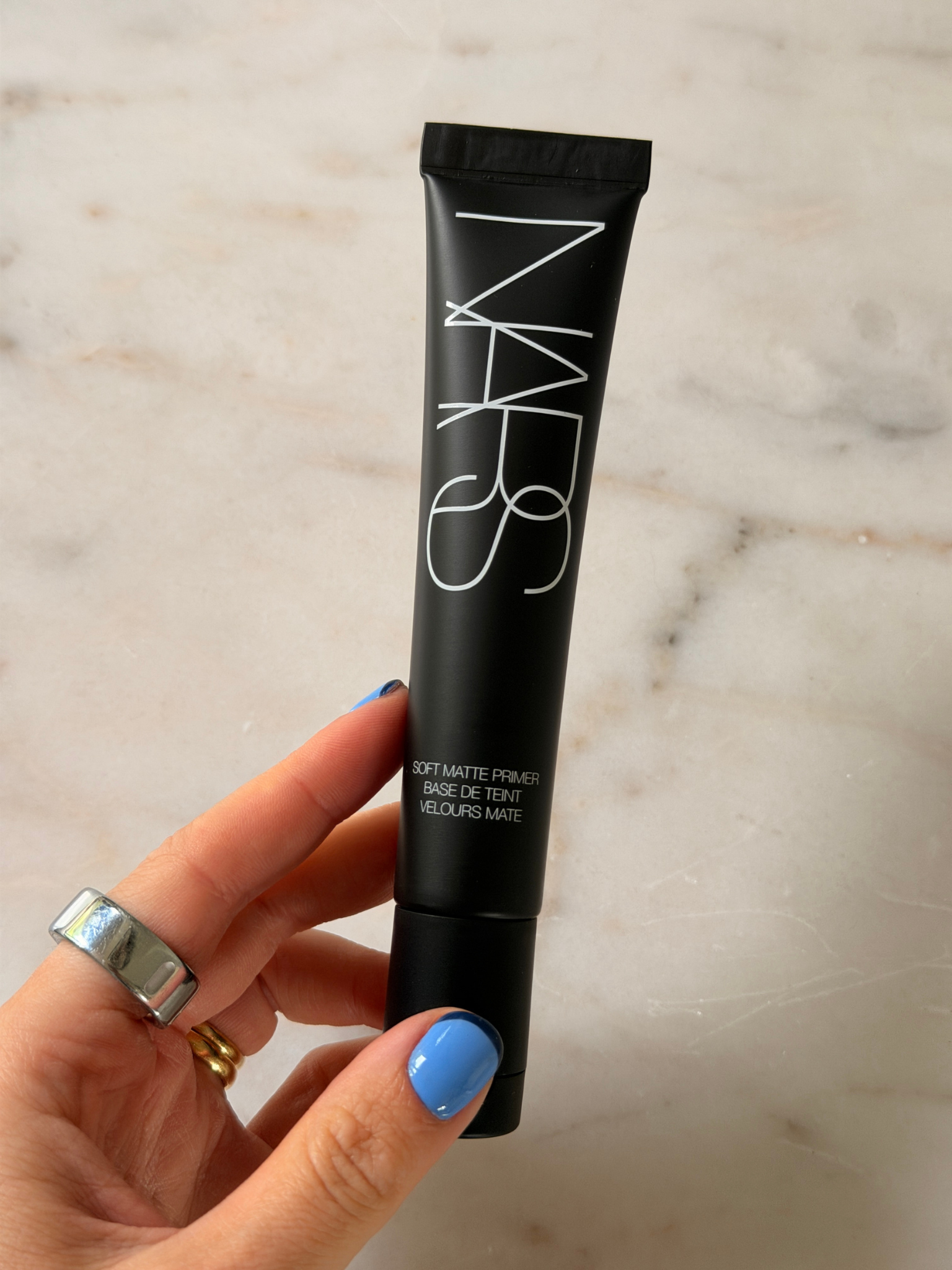 Grace holding the Nars primer