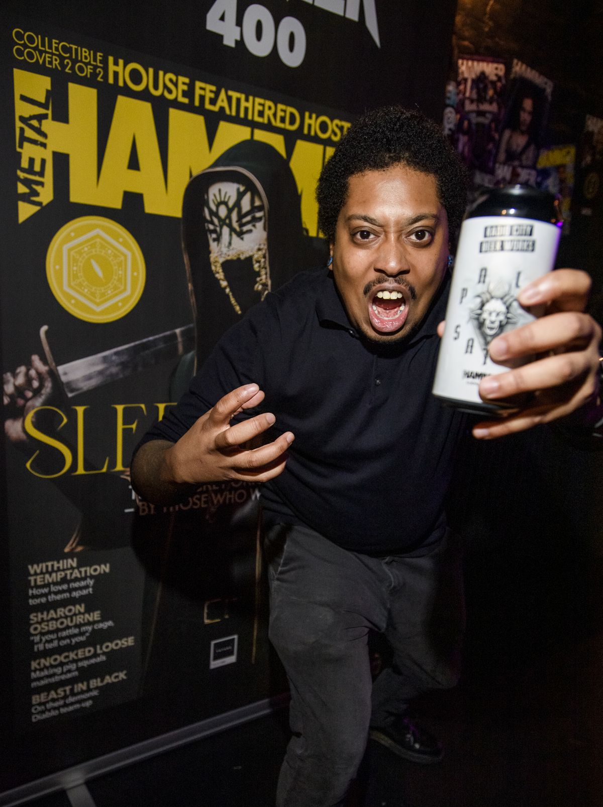 A man screaming with a beer in hand