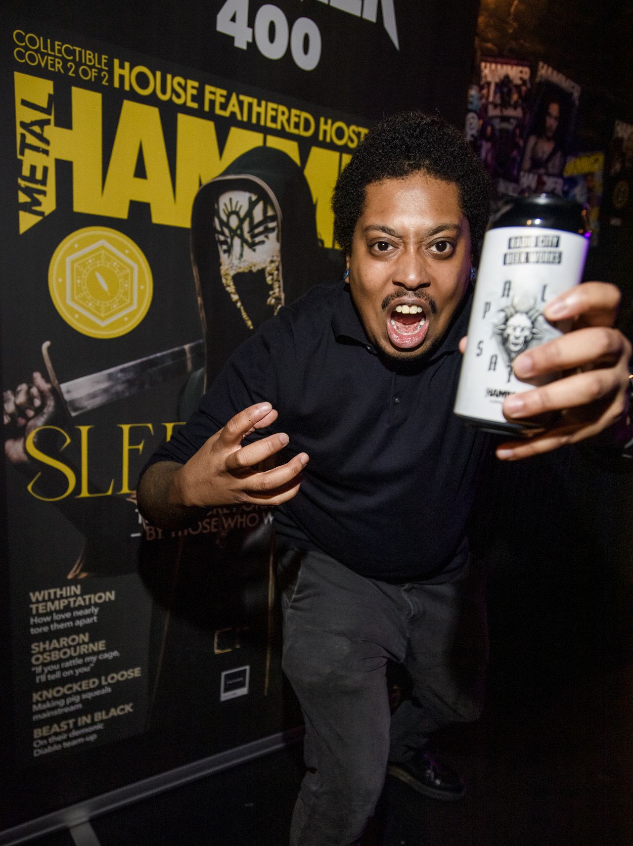 A man screaming with a beer in hand