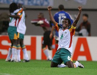 Senegal defender Aliou Cisse celebrates after his side's 1-0 win over France at the 2002 World Cup.