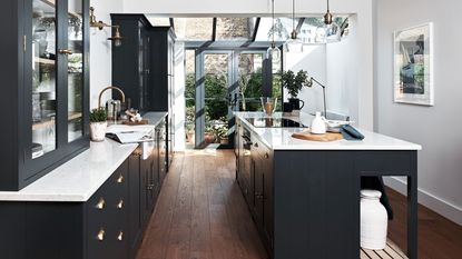 modern kitchen with island and white worktops