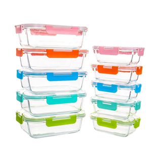 Multiple glass food storage containers with colorful lids