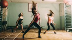 Can you lose weight with dance workouts? image shows women working out by dancing