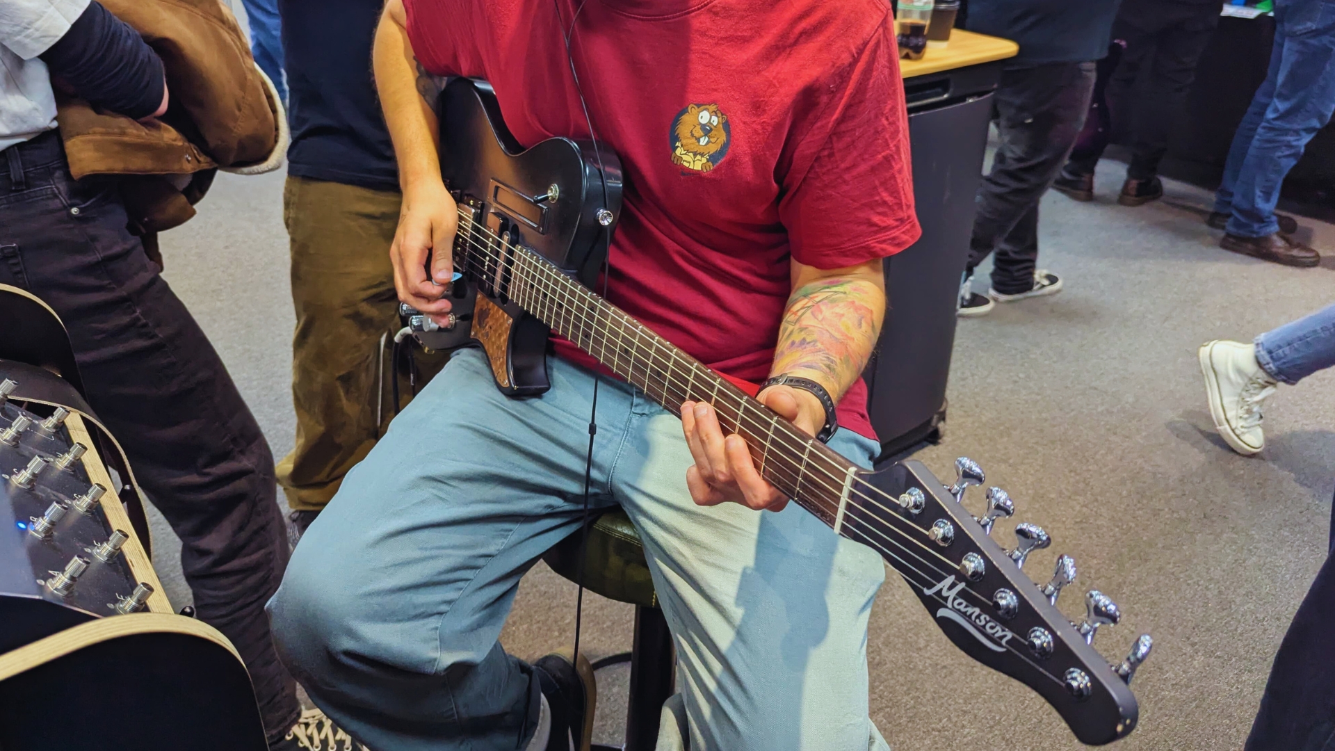 MusicRadar author Matt McCracken plays a Manson 007 electric guitar at The Guitar Show in Birmingham, UK