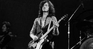 Jimmy Page onstage with Led Zeppelin playing a Danelectro Shorthorn