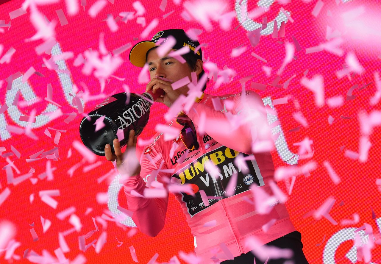 Primoz Roglic (Jumbo-Visma) in the pink of race leader on the stage 3 podium