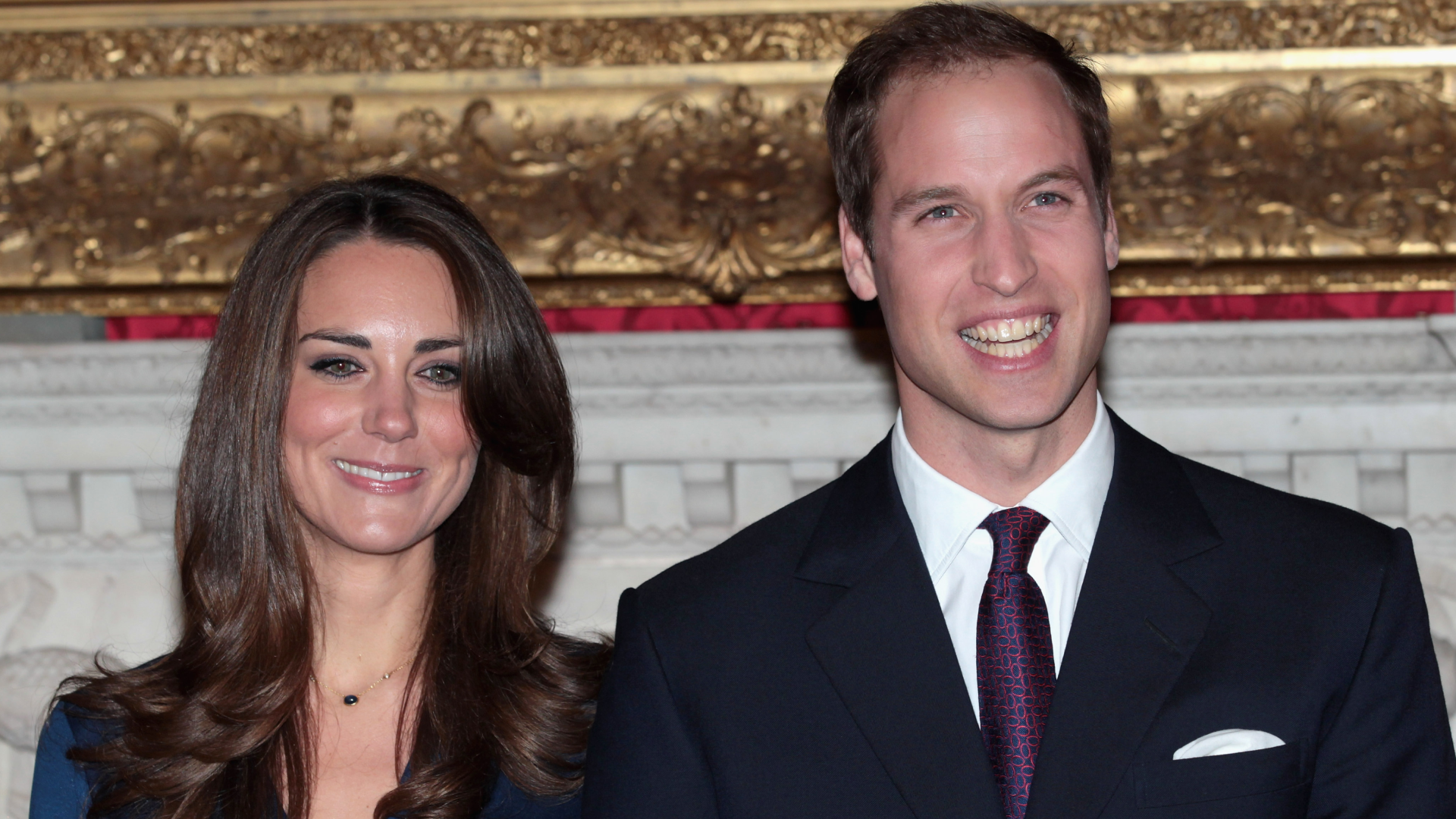 Kate Middleton and Prince William smiling during their engagement announcement