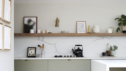Small kitchen with open shelving and marble backsplash