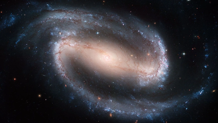 Webb image of COSMOS-74706, with logarithmic spirals (as white lines) showing the arms and bar structure. 