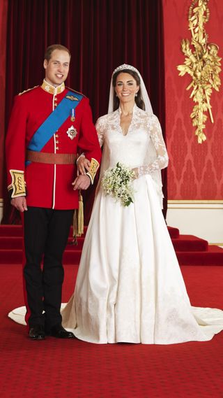 Handout photo issued by Clarence House of The Bride and Groom in the throne room at Buckingham Palace