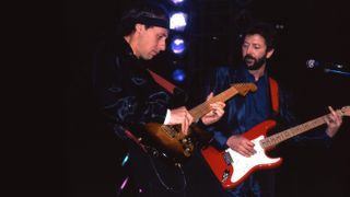 Photo of Mark KNOPFLER and DIRE STRAITS and Eric CLAPTON; Mark Knopfler and Eric Clapton performing live onstage