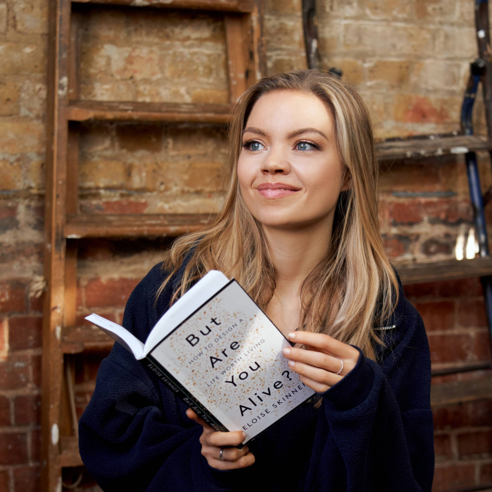 Eloise Skinner holding her book