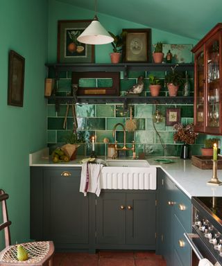 Green painted kitchen by deVOL