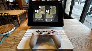 8BitDo controller playing GoldenEye on iPad Pro in coffee place