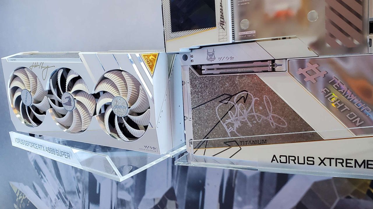 A photo of Intel's Pat Gelsinger and Nvidia's Jen-Hsun Huang signatures on a Gigabyte motherboard and graphics card, on display at Computex 2024