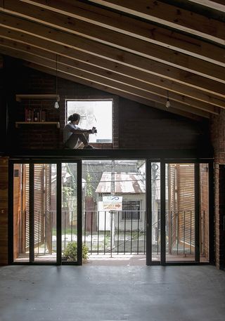interior space inside brick house by Natura Futura