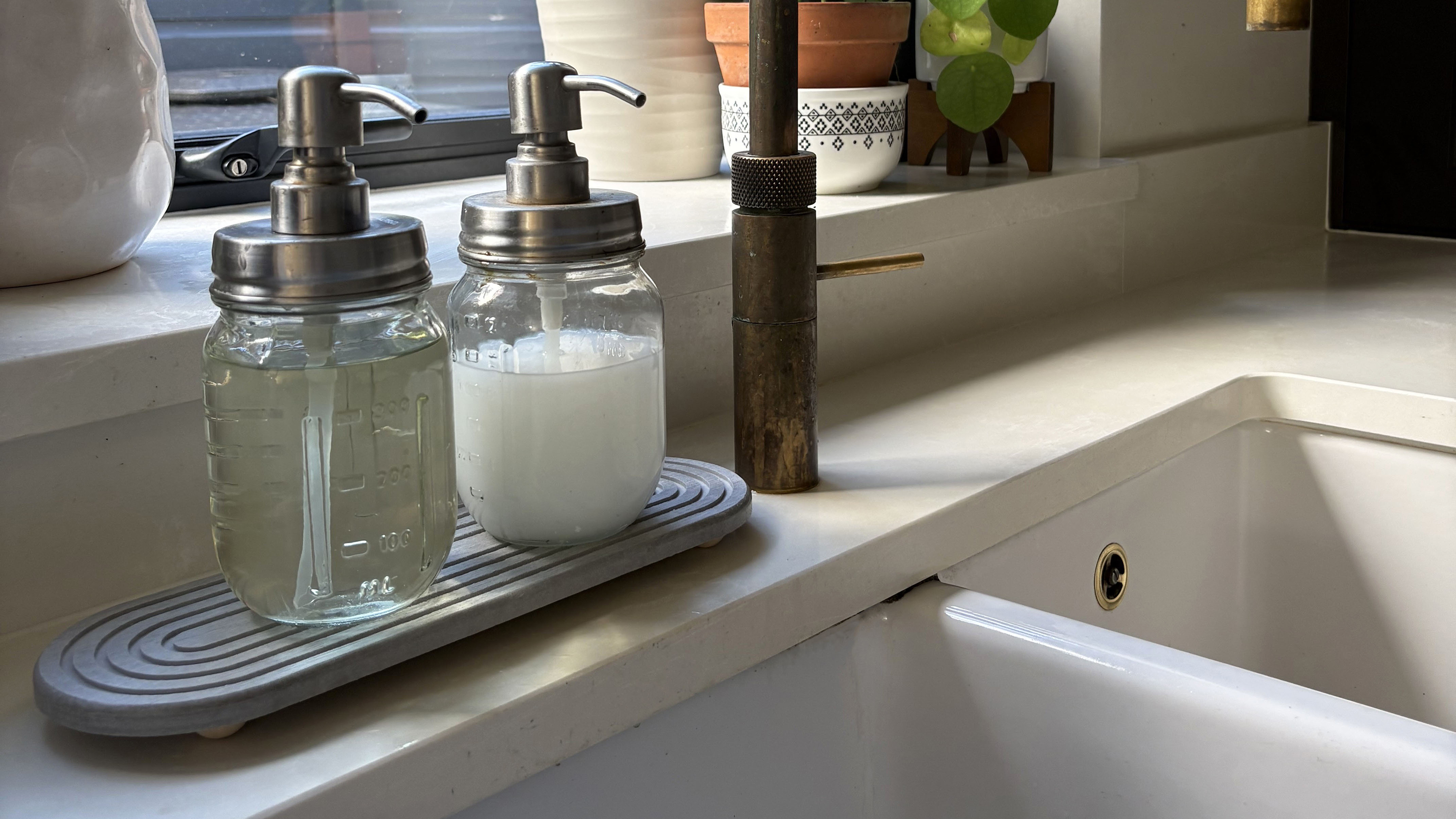 Stone sink caddy in kitchen