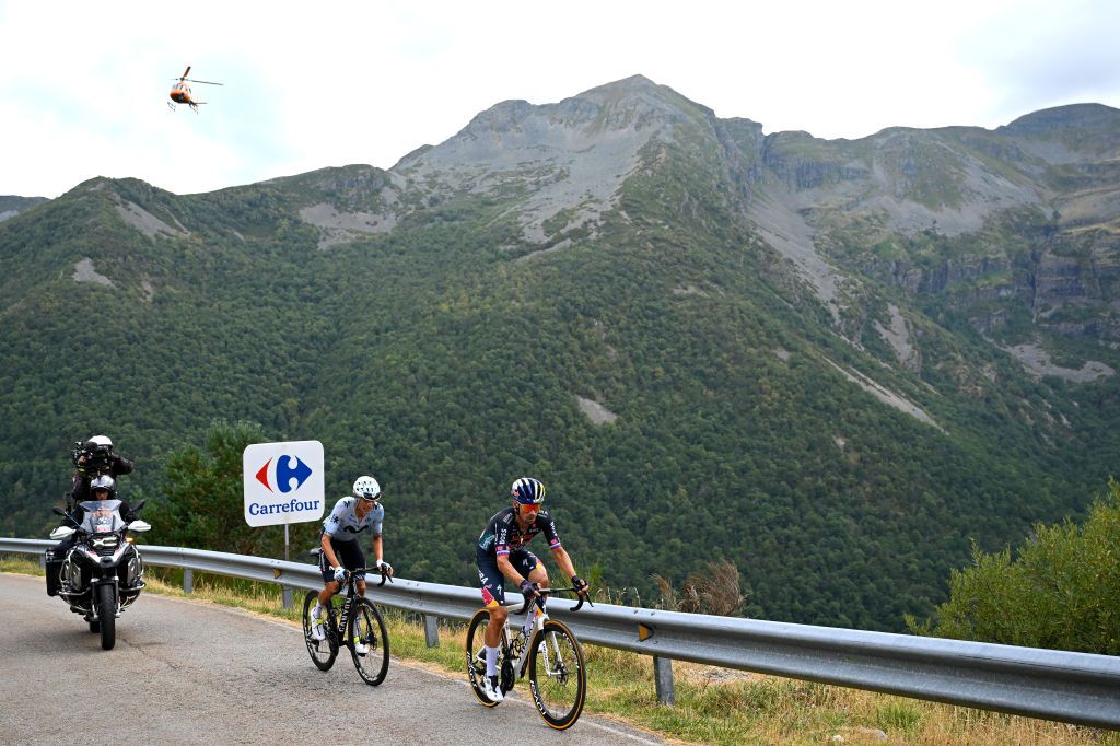 PUERTO DE ANCARES SPAIN AUGUST 30 LR Enric Mas of Spain and Team Movistar and Primoz Roglic of Slovenia and Team Red Bull Bora hansgrohe attack during the La Vuelta 79th Tour of Spain 2024 Stage 13 a 176km stage from Lugo to Puerto de Ancares 1659m UCIWT on August 30 2024 in Puerto de Ancares Spain Photo by Dario BelingheriGetty Images