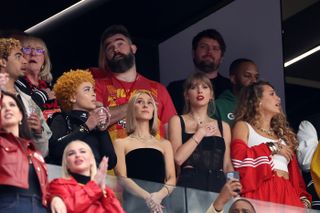 Taylor Swift wears red lipstick at the 2024 Super Bowl.