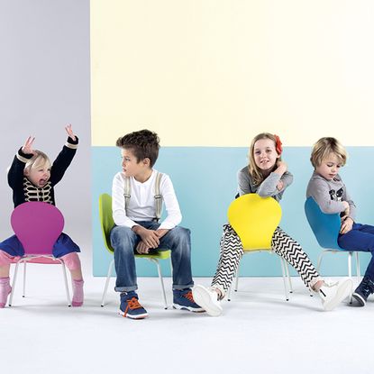 child room with multicolor chair and white flooring