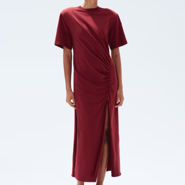 A model wearing a burgundy midi dress