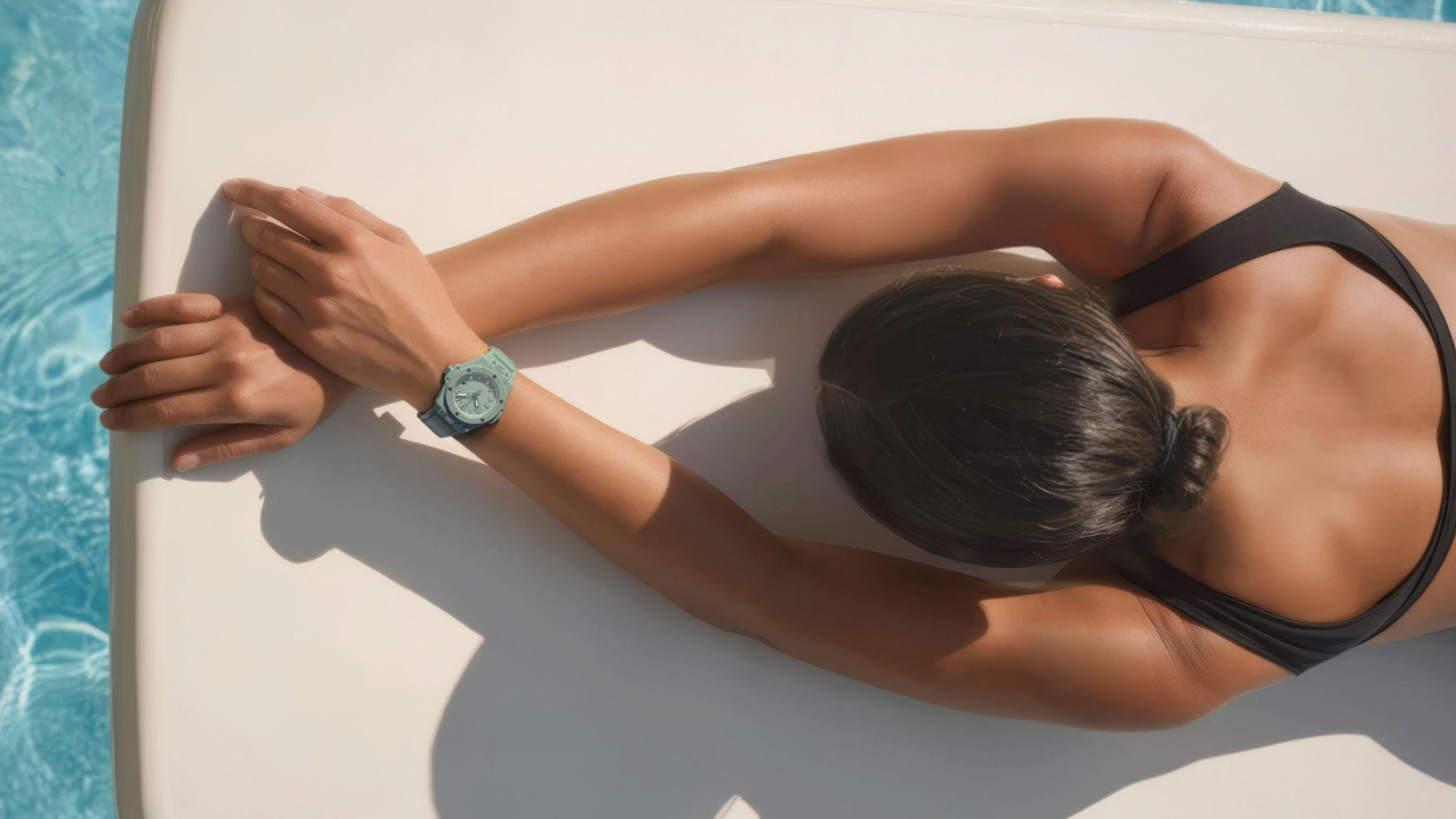 woman wearing Hublot green watch