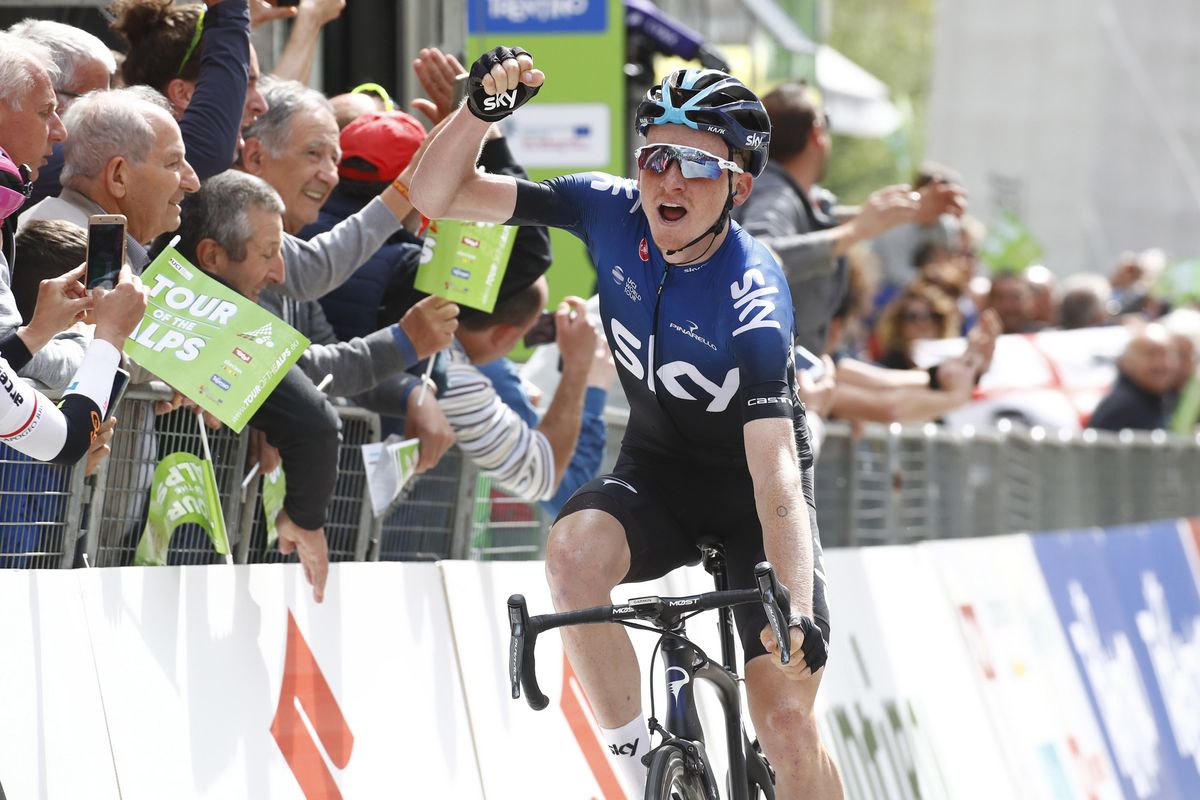 Tao Geoghegan Hart raises his arm in celebration once again