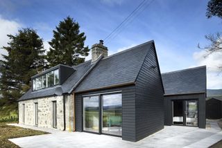 black timber clad extension to period cottage