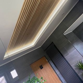 bathroom ceiling with wooden and mirror