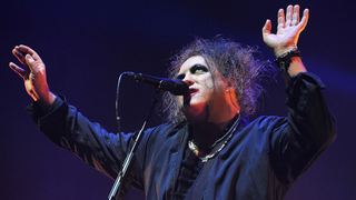Robert Smith of The Cure performs live on stage at Wembley Arena on December 1, 2016 in London, England.