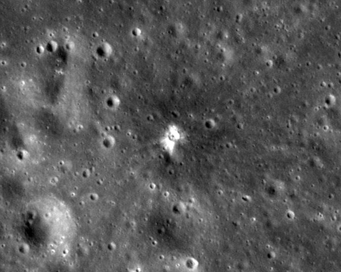 This image, taken by the LROC instrument aboard NASA&#039;s Lunar Reconnaissance Orbiter on July 28, 2013, shows the 62-foot-wide (18.8 meters) moon crater (center) produced by an impact on March 17, 2013.